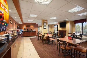 breakfast buffet with table and chair seating at Ramada by Wyndham Wisconsin Dells